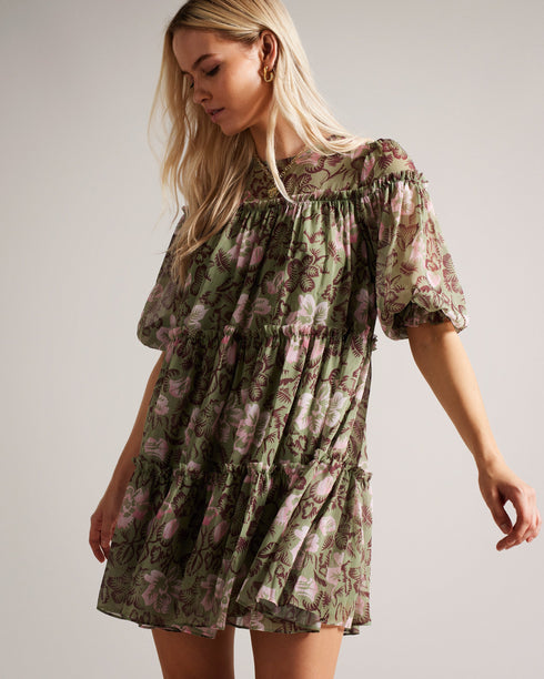 BUNNOO-Dresses-Dress up with a touch of flirty sophistication in BUNNOO. Made from a soft, lightweight fabric, this tiered swing dress features a stunning floral print and floaty tiered skirt. Dreamy.The fabric of this product is made of 100% recycled polyester. Using recycled polyester helps divert plastic waste from ending in landfills. Mini tiered swing dress Georgette texture 3/4 sleeved Self tie back Crew neck Floral Print Wendy is 5'9.5" / 1.77m and wears Khaki in a Ted size 1- Ted Baker Romania